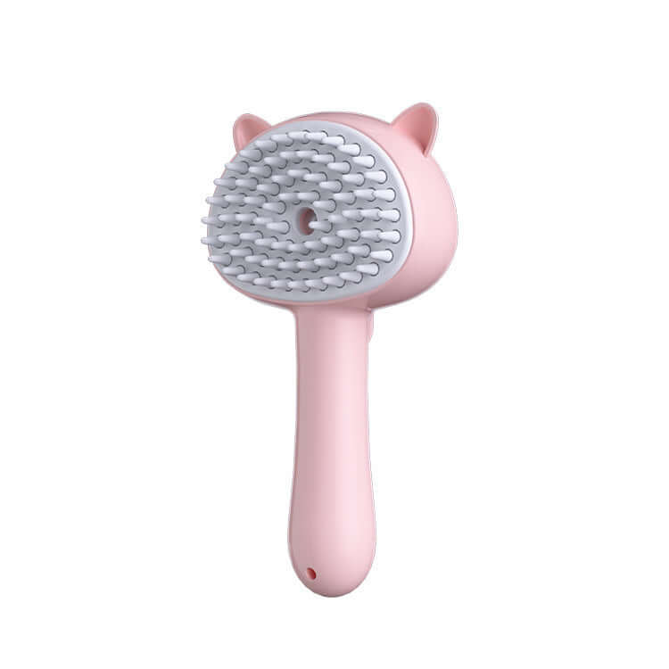 Cat grooming brush with self-cleaning feature in cute pink design, ideal for reducing shedding and massaging pets.