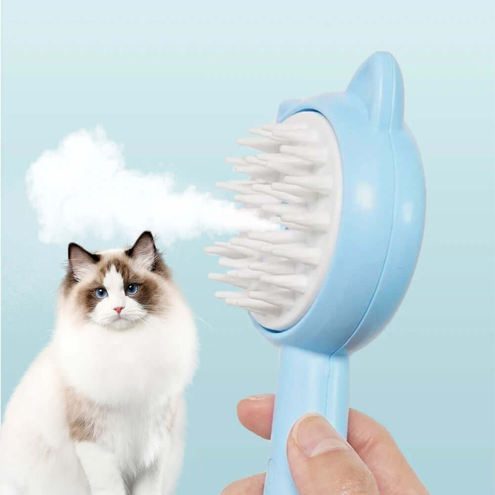 Rechargeable self-cleaning cat grooming brush removing hair from fluffy cat with steam technology.
