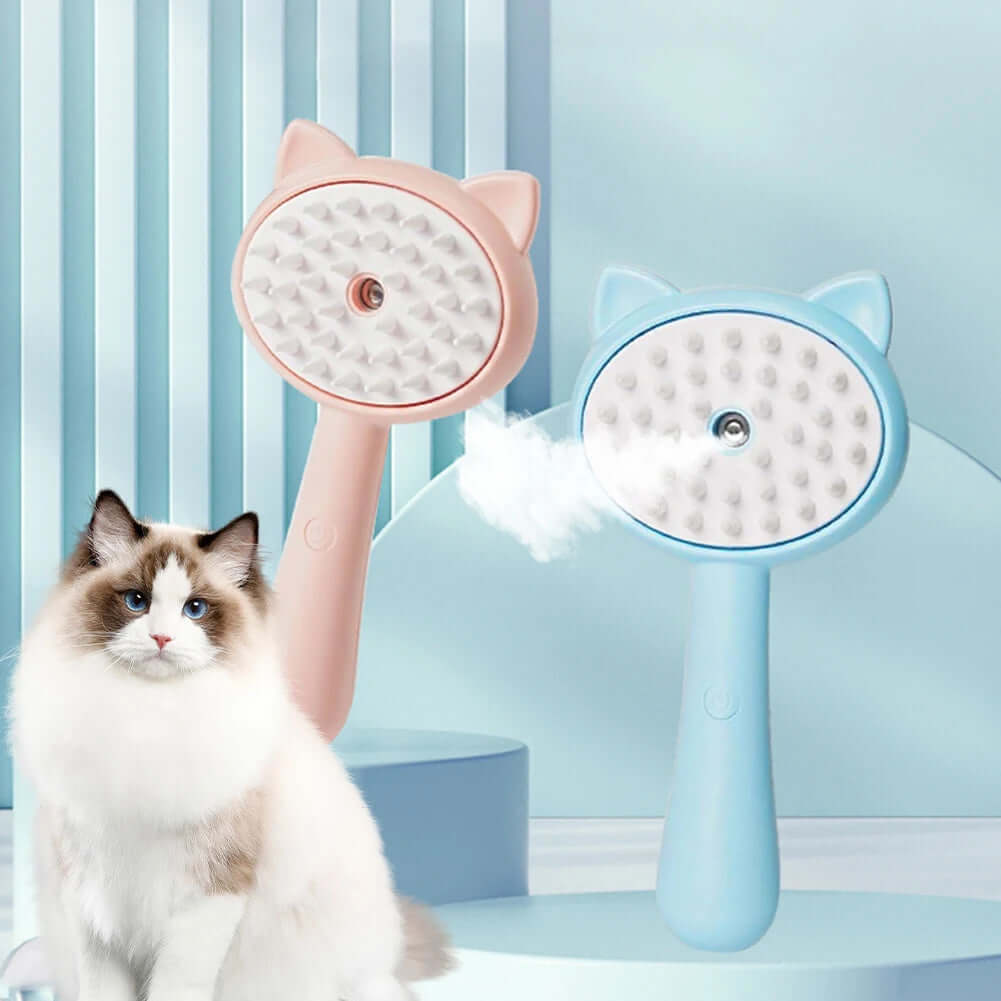 Rechargeable self-cleaning cat grooming brush in pink and blue beside a fluffy cat, enhancing pet care experience.