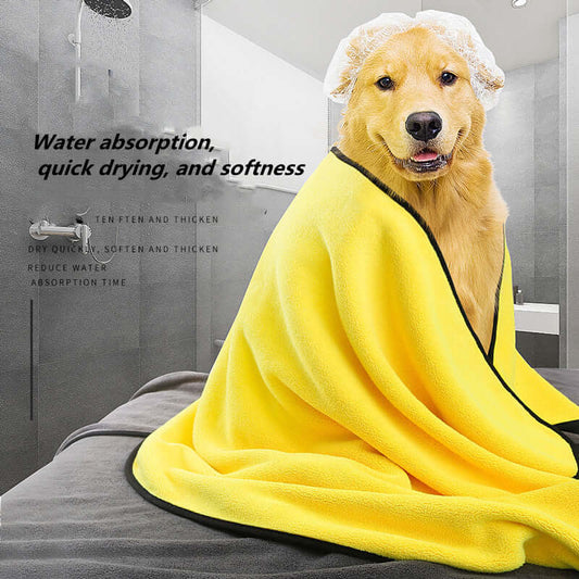 Golden retriever wrapped in a yellow quick-drying towel, highlighting water absorption and softness.