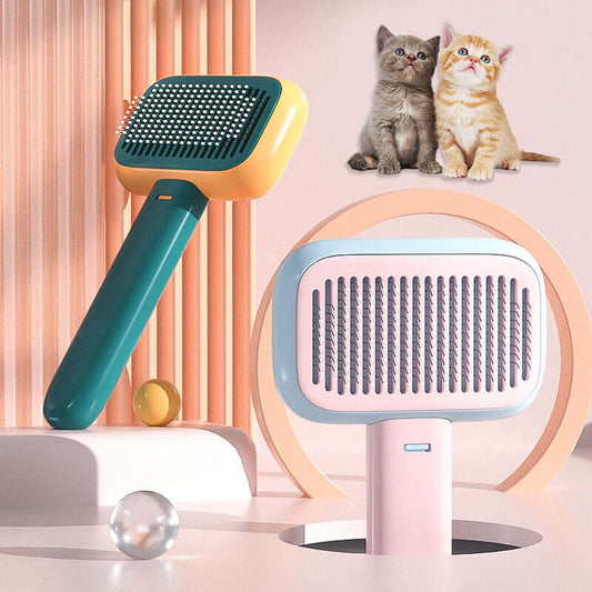 Open-knot grooming brush in smoke grey and pastel colors with playful kittens in the background.
